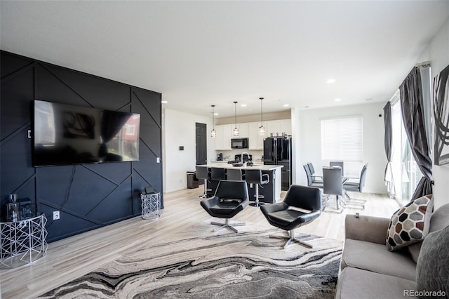 26985 E Bayaud Ave, Aurora, CO 80018 - living room with light wood-type flooring and recessed lighting