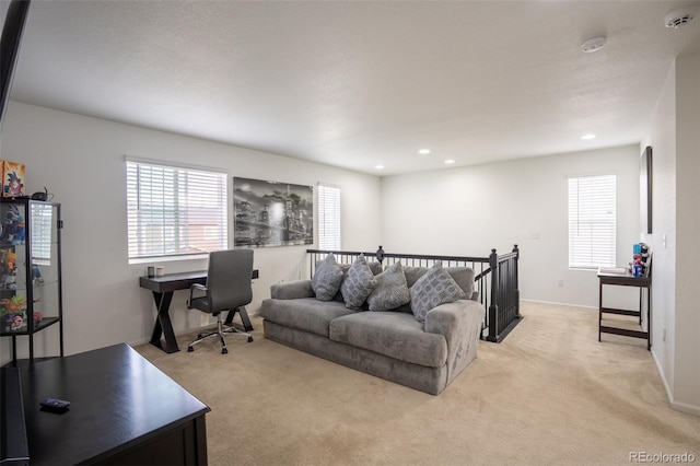 26985 E Bayaud Ave, Aurora, CO 80018 - living area with light colored carpet, an office area, recessed lighting, and baseboards