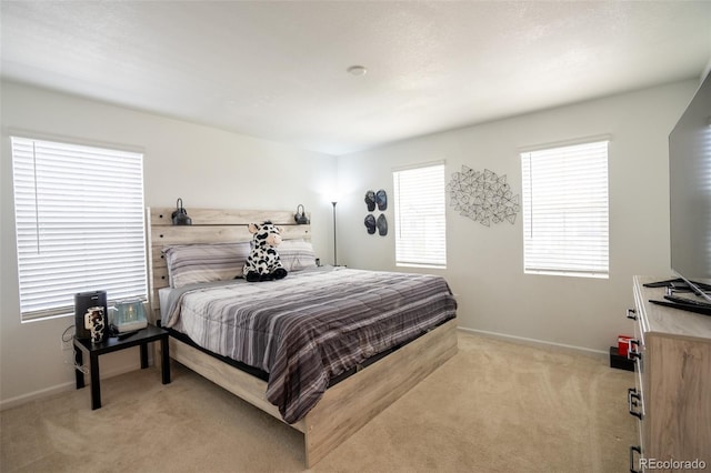 26985 E Bayaud Ave, Aurora, CO 80018 - bedroom featuring light carpet and baseboards