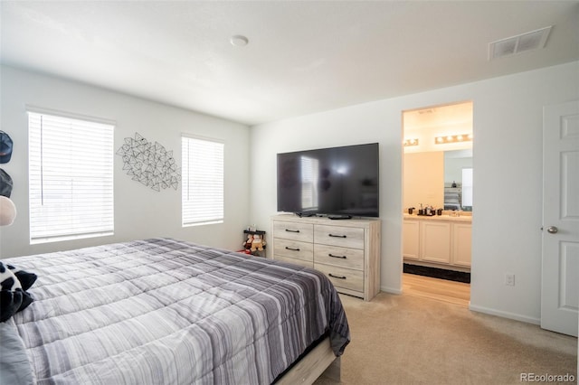 26985 E Bayaud Ave, Aurora, CO 80018 - bedroom featuring light colored carpet and a sink
