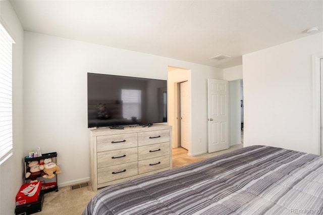 26985 E Bayaud Ave, Aurora, CO 80018 - bedroom featuring light carpet and baseboards