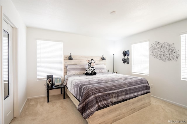 26985 E Bayaud Ave, Aurora, CO 80018 - bedroom with light colored carpet and baseboards