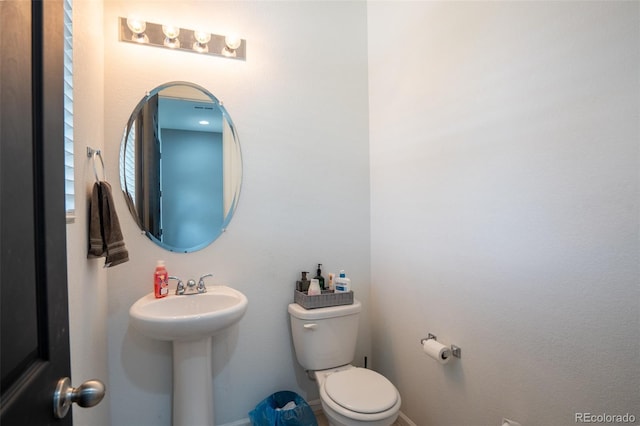 26985 E Bayaud Ave, Aurora, CO 80018 - bathroom featuring toilet and a sink