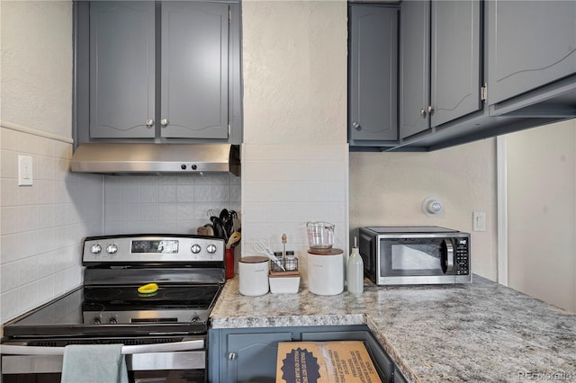 kitchen featuring stainless steel appliances and gray cabinetry