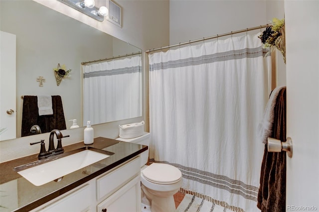 full bathroom featuring vanity, tile patterned floors, curtained shower, and toilet