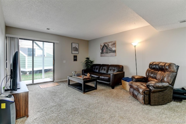 carpeted living room featuring a textured ceiling and visible vents