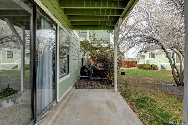 view of patio / terrace featuring fence