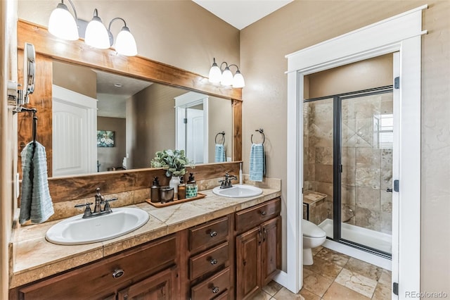 full bath with double vanity, a stall shower, toilet, and a sink