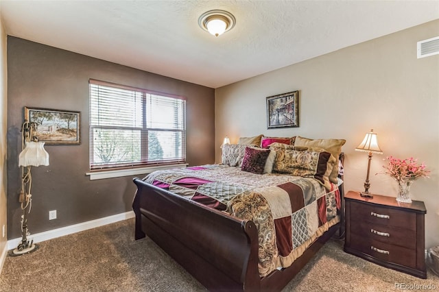 carpeted bedroom with visible vents and baseboards