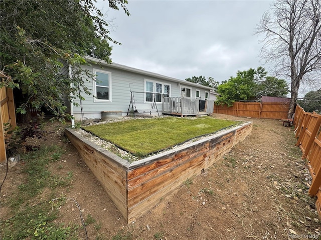 1390 W 78th Cir, Denver, CO 80221 - rear view of property with a fenced backyard and a deck