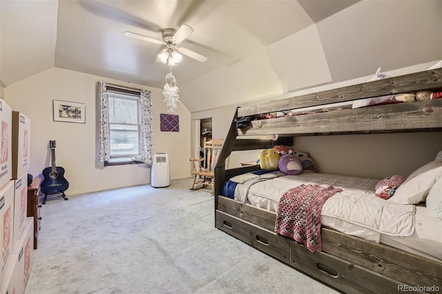 carpeted bedroom featuring ceiling fan and vaulted ceiling