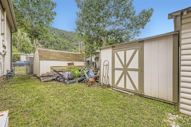 view of outdoor structure featuring a yard