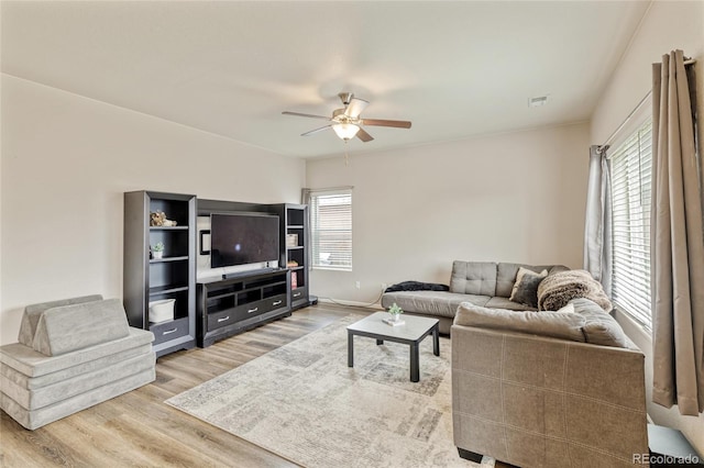 7232 Shavano Ave, Frederick, CO 80504 - living area featuring light wood-style floors, a ceiling fan, and baseboards