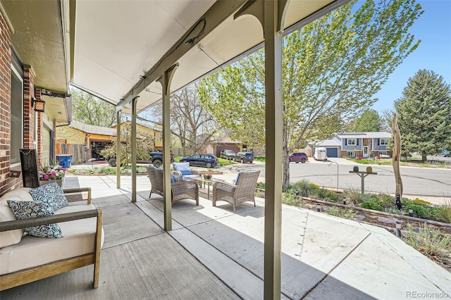 view of patio / terrace featuring outdoor lounge area and a residential view