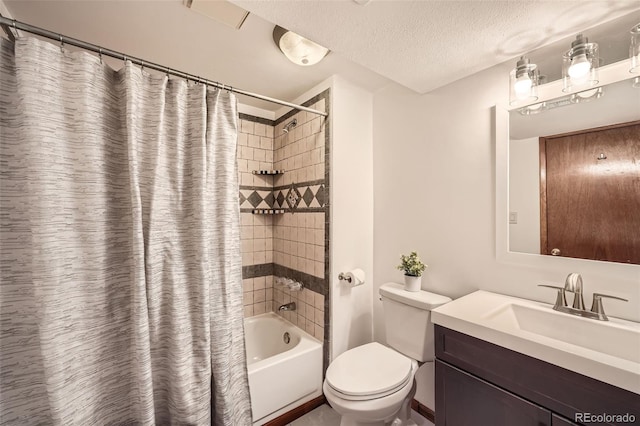 bathroom featuring toilet, shower / tub combo with curtain, vanity, and a textured ceiling