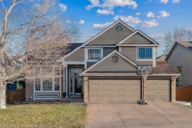 view of front of house featuring a garage and a front lawn