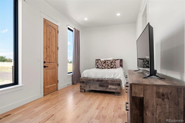 bedroom with light hardwood / wood-style flooring