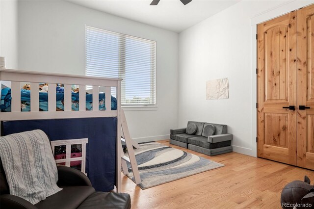 bedroom featuring ceiling fan and light wood-type flooring