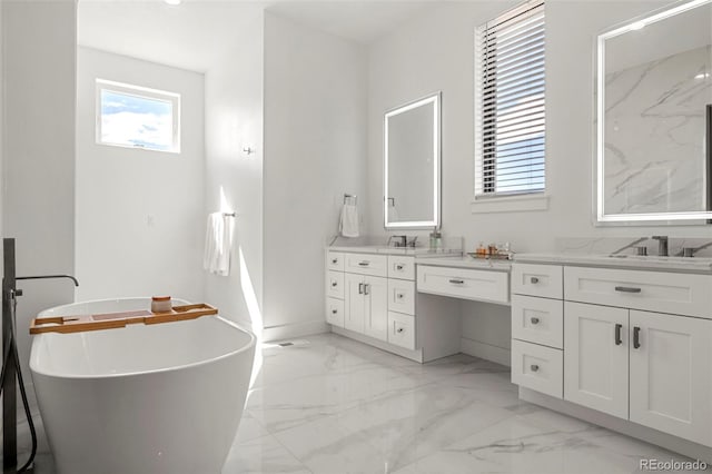 bathroom with tile patterned floors, double vanity, and a bathing tub