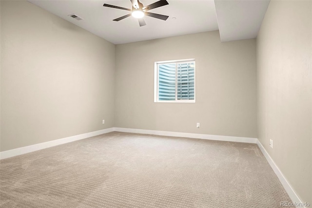 unfurnished room with ceiling fan and carpet flooring