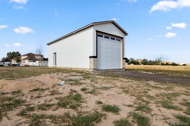 view of outbuilding with a garage