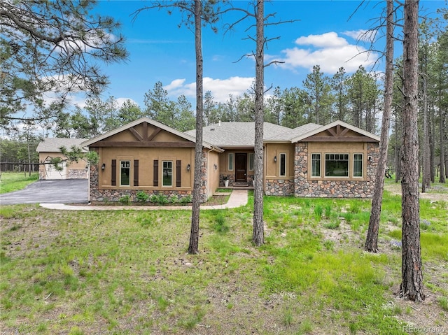 16104 Pole Pine Pt, Colorado Springs, CO 80908 - ranch-style house featuring stone siding, stucco siding, and a front lawn
