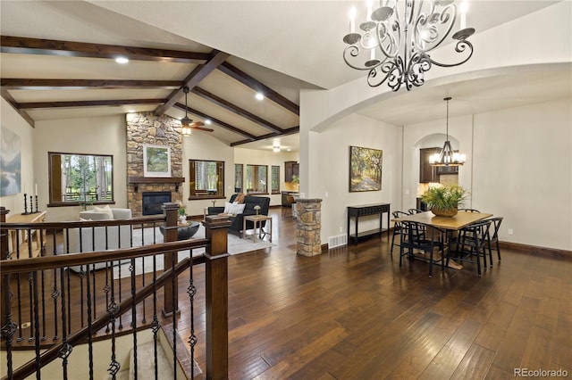 16104 Pole Pine Pt, Colorado Springs, CO 80908 - dining space with a chandelier, a fireplace, hardwood / wood-style floors, arched walkways, and ceiling fan