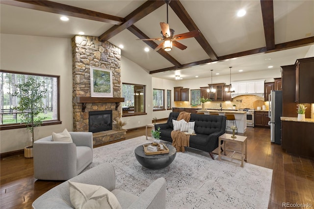 16104 Pole Pine Pt, Colorado Springs, CO 80908 - living room with ceiling fan, a fireplace, dark wood-style flooring, and recessed lighting