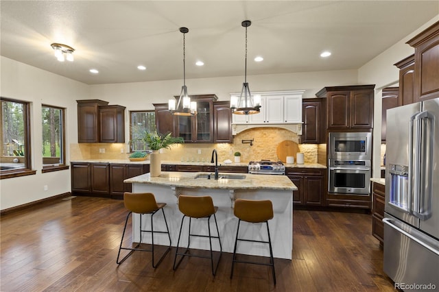 16104 Pole Pine Pt, Colorado Springs, CO 80908 - kitchen with appliances with stainless steel finishes, dark wood-style flooring, dark brown cabinets, and recessed lighting