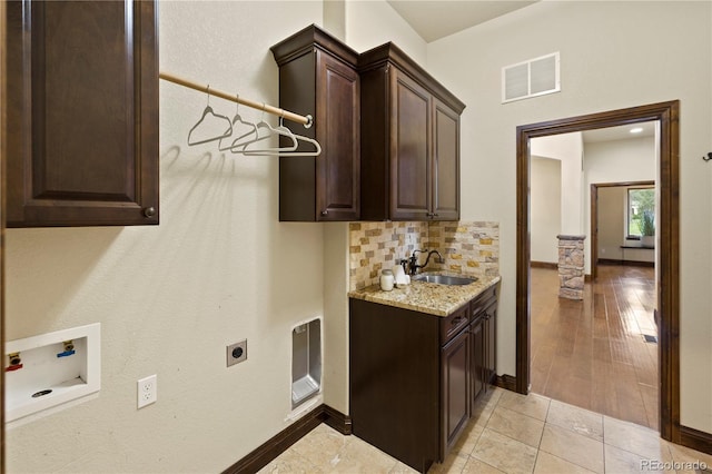 16104 Pole Pine Pt, Colorado Springs, CO 80908 - laundry room featuring hookup for an electric dryer, hookup for a washing machine, and cabinet space