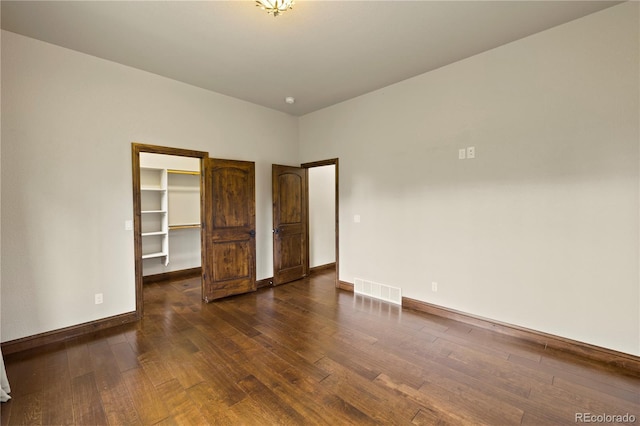 16104 Pole Pine Pt, Colorado Springs, CO 80908 - unfurnished room featuring dark wood-style floors and baseboards