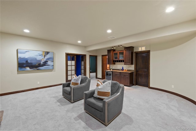 16104 Pole Pine Pt, Colorado Springs, CO 80908 - living area with bar with sink, light carpet, recessed lighting, and beverage cooler