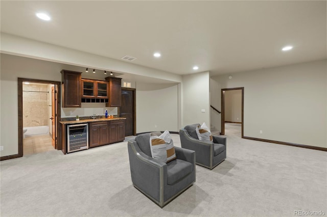 16104 Pole Pine Pt, Colorado Springs, CO 80908 - living room featuring beverage cooler, wet bar, light carpet, recessed lighting, and stairs