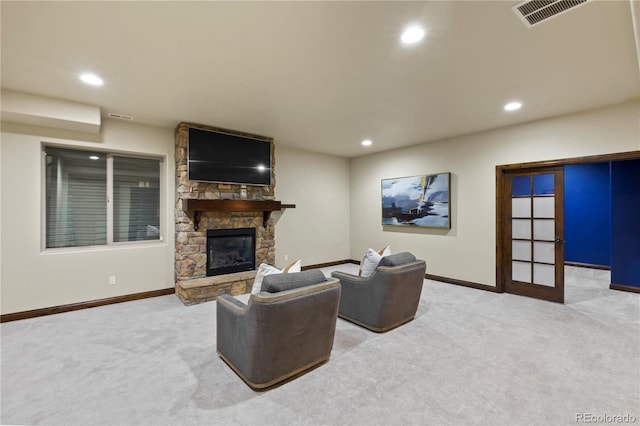 16104 Pole Pine Pt, Colorado Springs, CO 80908 - living room featuring carpet floors, recessed lighting, and a stone fireplace