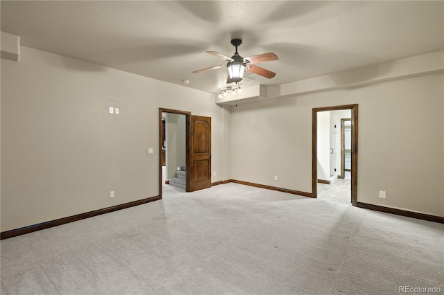 16104 Pole Pine Pt, Colorado Springs, CO 80908 - spare room featuring light carpet and a ceiling fan
