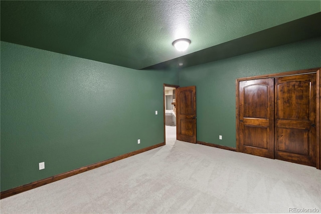 16104 Pole Pine Pt, Colorado Springs, CO 80908 - unfurnished bedroom featuring carpet flooring, a textured ceiling, and a textured wall