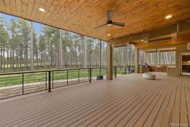 16104 Pole Pine Pt, Colorado Springs, CO 80908 - wooden terrace with ceiling fan and view of wooded area