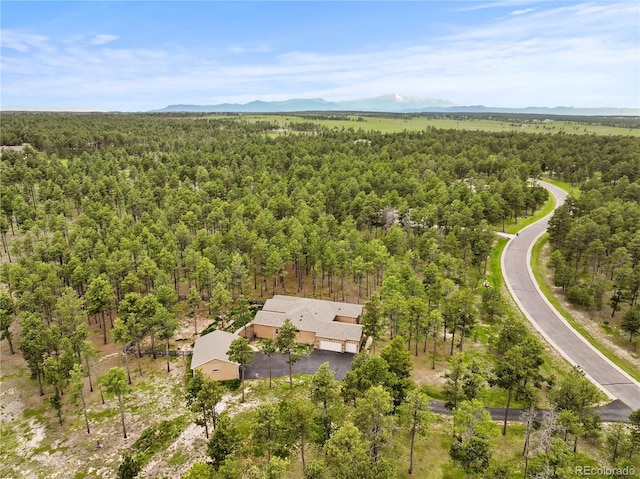 16104 Pole Pine Pt, Colorado Springs, CO 80908 - drone / aerial view of a heavily wooded area and mountains