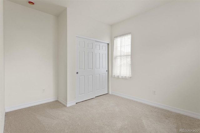 8464 E 55th Pl, Denver, CO 80238 - unfurnished bedroom featuring carpet flooring, baseboards, and a closet