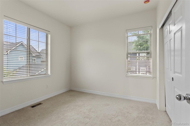 8464 E 55th Pl, Denver, CO 80238 - unfurnished bedroom with light carpet, a closet, and baseboards