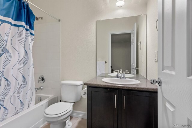 8464 E 55th Pl, Denver, CO 80238 - bathroom featuring shower / tub combo, vanity, toilet, and a textured wall