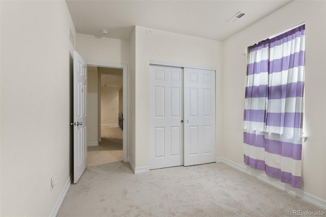 8464 E 55th Pl, Denver, CO 80238 - unfurnished bedroom with carpet floors, baseboards, and a closet