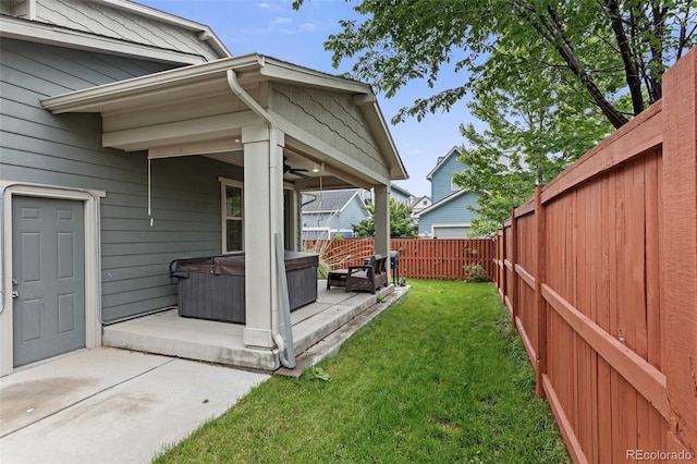 8464 E 55th Pl, Denver, CO 80238 - view of yard featuring a hot tub, a patio, and a ceiling fan
