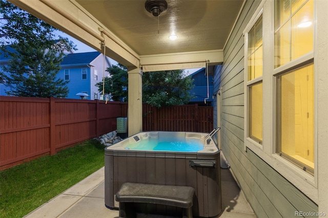 8464 E 55th Pl, Denver, CO 80238 - fenced backyard with a hot tub and a patio area
