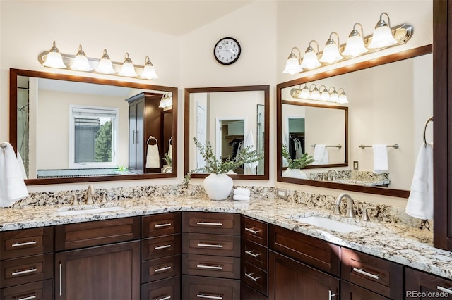 bathroom featuring double vanity and a sink