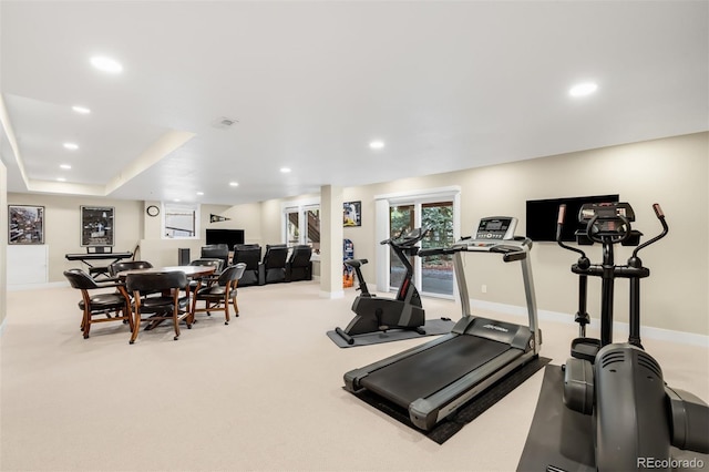 exercise area featuring recessed lighting, baseboards, and carpet floors