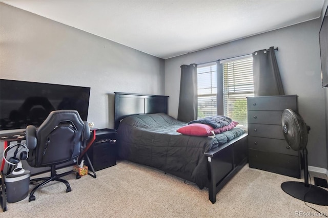 bedroom with light carpet