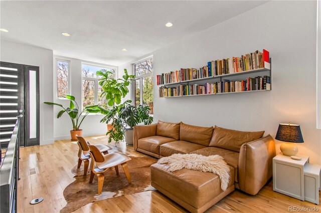 living room with recessed lighting and light wood-style floors