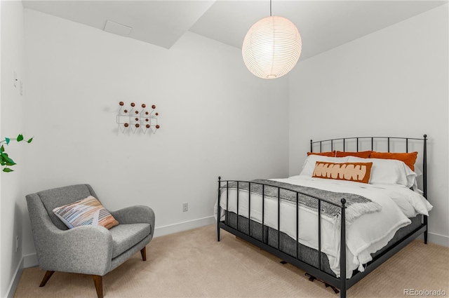 bedroom featuring carpet flooring and baseboards