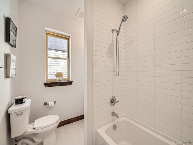 bathroom featuring marble finish floor, visible vents, toilet, shower / tub combination, and baseboards